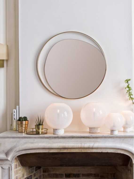 Red Edition Ellipse mirror · fireplace setting